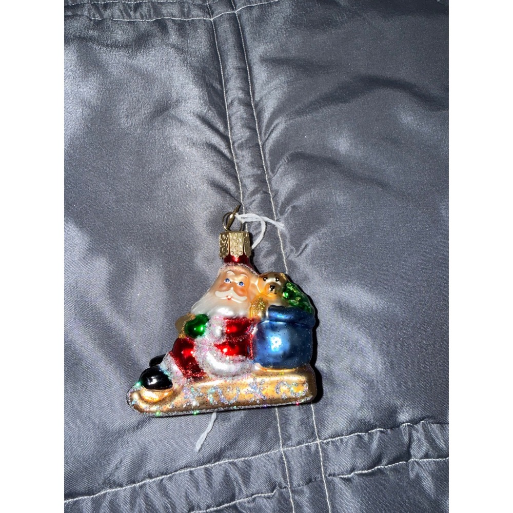 Old World Christmas Santa on Sled Glass Ornament Blue Toy Bag Teddy Bear OWC
